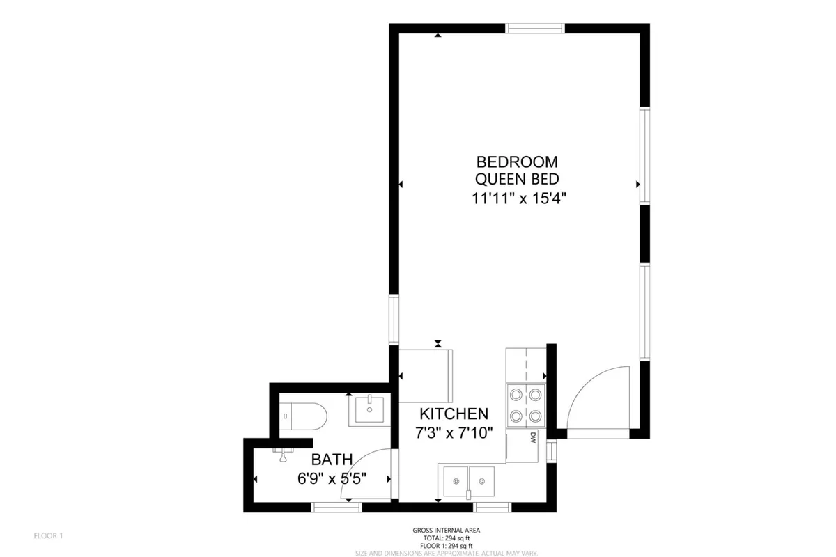 This image showcases the cozy interior of a cottage unit, highlighting a queen bed, kitchen appliances, and bathroom fixtures all within view. The space appears inviting and self-contained—perfect for couples or friends seeking privacy and comfort.